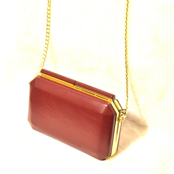 BCBG red clutch
